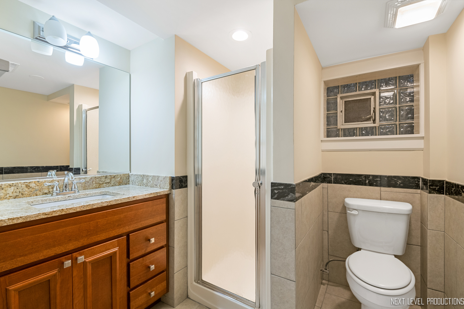 115 Birch Avenue Lake Bluff, IL 60044 - Photo 31 of 39 a bathroom with a granite countertop sink toilet and shower