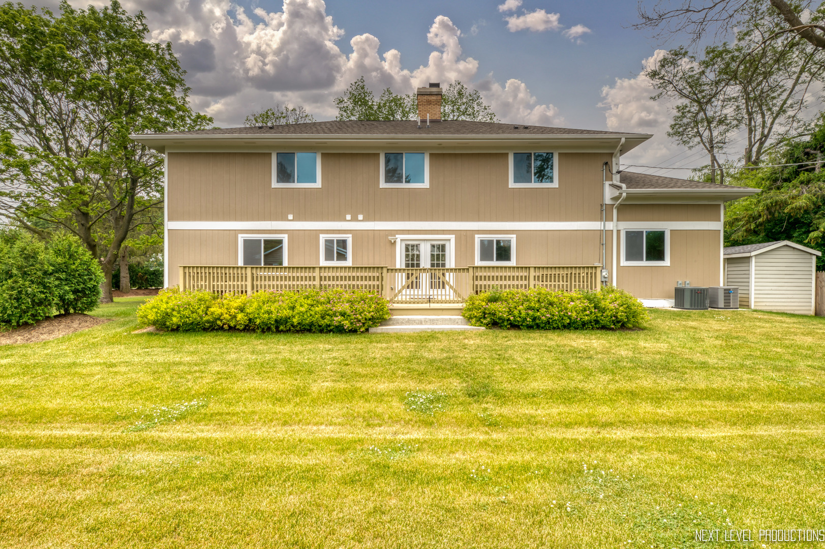 115 Birch Avenue Lake Bluff, IL 60044 - Photo 36 of 39 a front view of a house with a garden