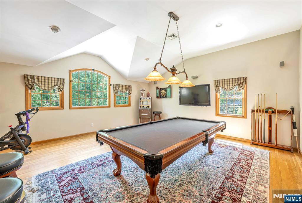 411 Snyder Road Wyckoff, NJ 07481 - Photo 27 of 36 a living room with pool table and windows