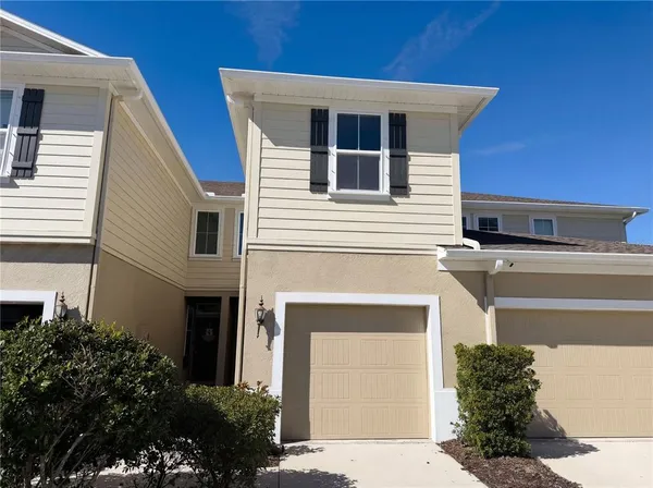 a front view of a house with a garage