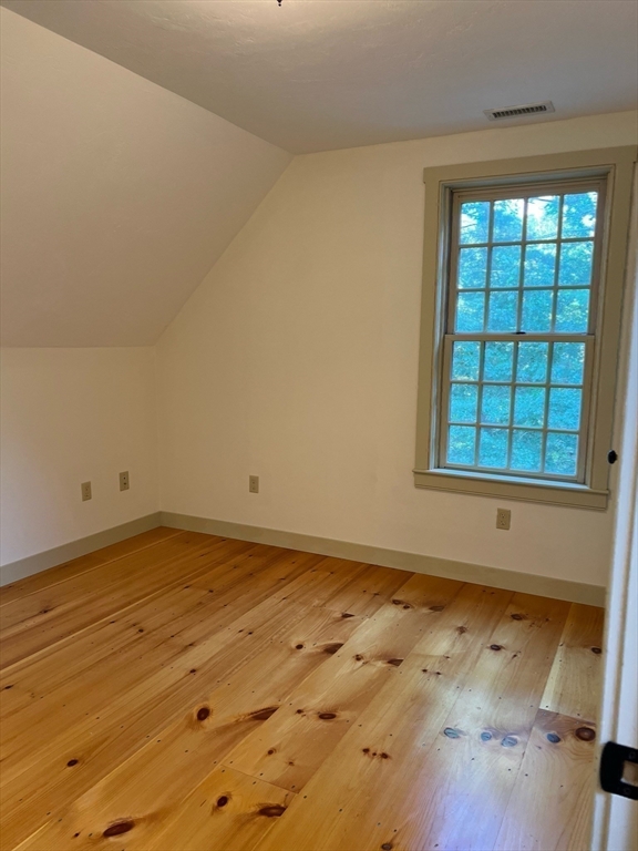 160 Quaker Street Northbridge, MA 01534 - Photo 15 of 36 an empty room with wooden floor and windows