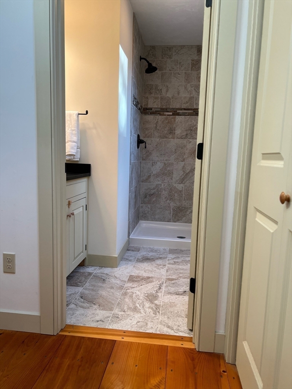 160 Quaker Street Northbridge, MA 01534 - Photo 16 of 36 a bathroom with a granite countertop shower mirror and a sink