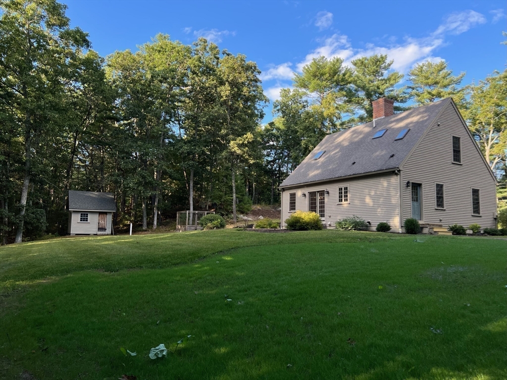 160 Quaker Street Northbridge, MA 01534 - Photo 30 of 36 a front view of a house with a garden