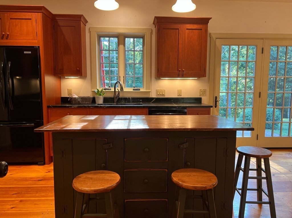 160 Quaker Street Northbridge, MA 01534 - Photo 3 of 36 a kitchen with a table chairs stove and sink