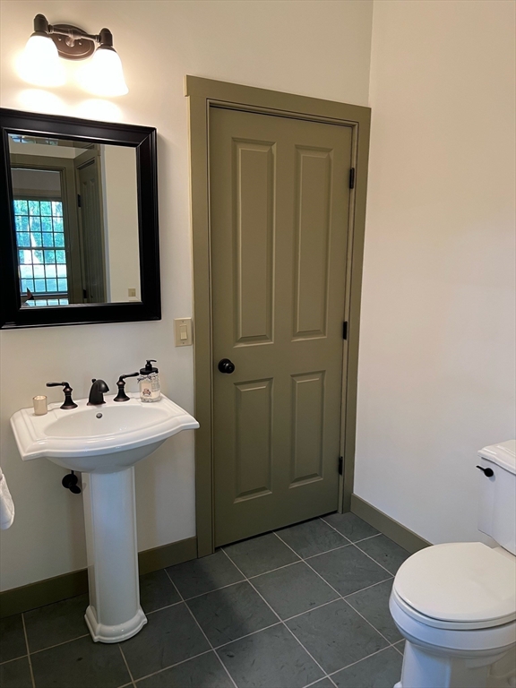 160 Quaker Street Northbridge, MA 01534 - Photo 10 of 36 a bathroom with a sink a toilet and mirror