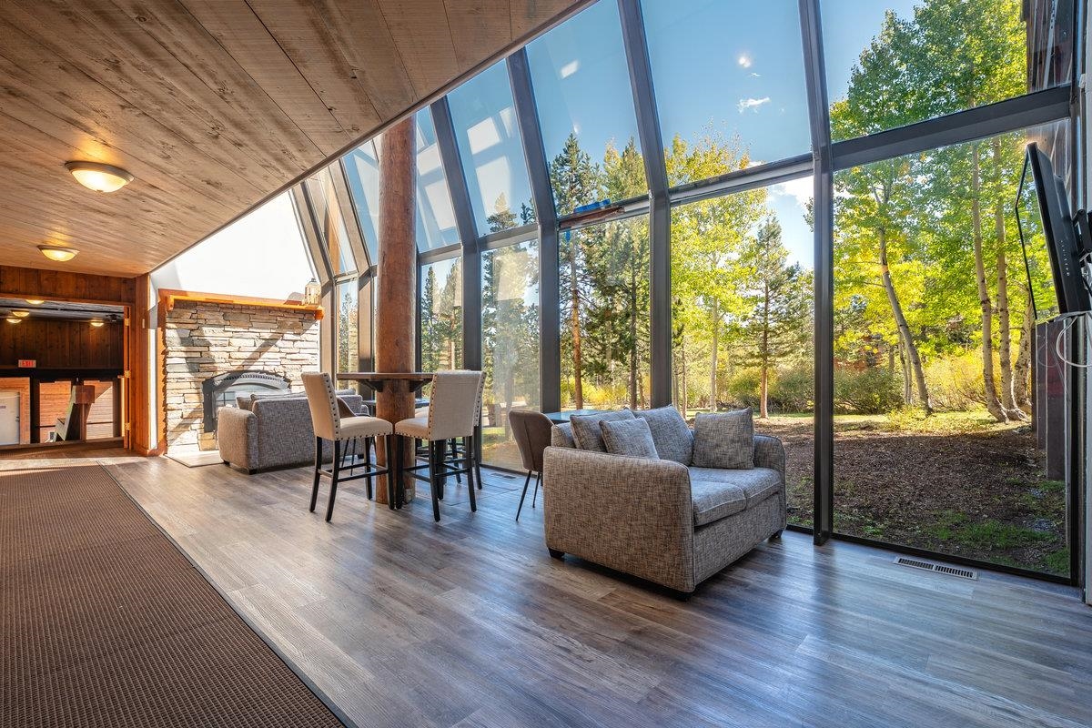 11591 Snowpeak Way, Unit 407 Truckee, CA 96161 - Photo 11 of 14 a living room with furniture and a floor to ceiling window