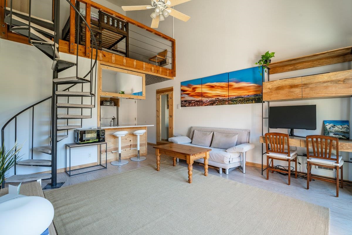 11591 Snowpeak Way, Unit 407 Truckee, CA 96161 - Photo 3 of 14 a reading room with furniture and a lamp