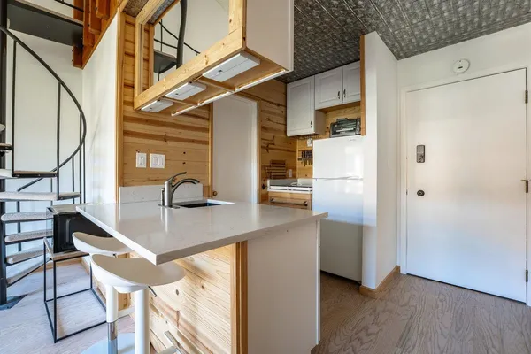 a view of a kitchen with appliances and cabinets