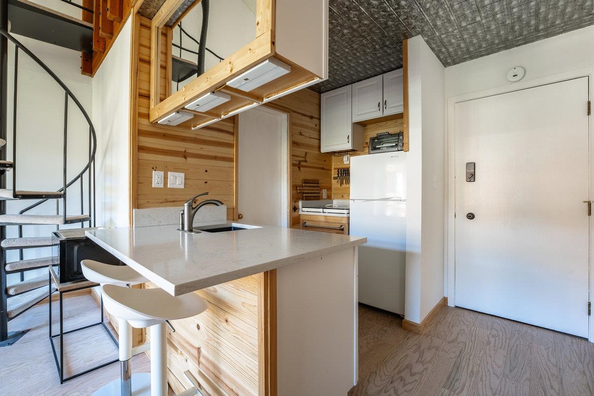 11591 Snowpeak Way, Unit 407 Truckee, CA 96161 - Photo 5 of 14 a view of a kitchen with appliances and cabinets