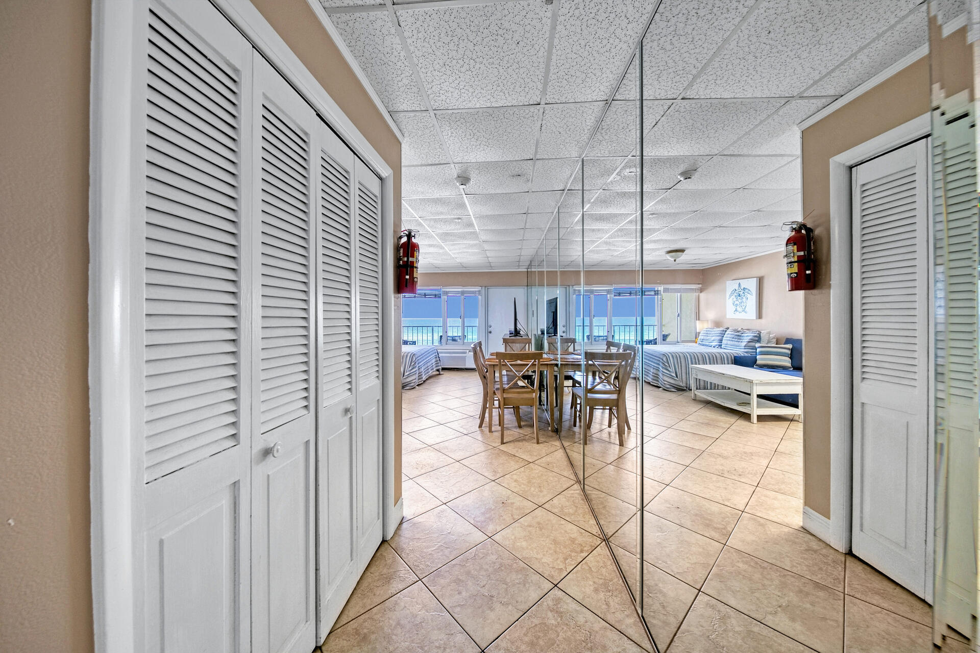 15413 Front Beach Road, Unit 505 Panama City Beach, FL 32413 - Photo 4 of 28 a view of a dining room with furniture and a window