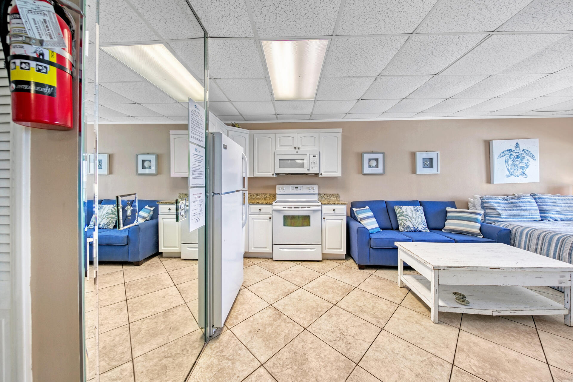 15413 Front Beach Road, Unit 505 Panama City Beach, FL 32413 - Photo 7 of 28 a living room with furniture and a table