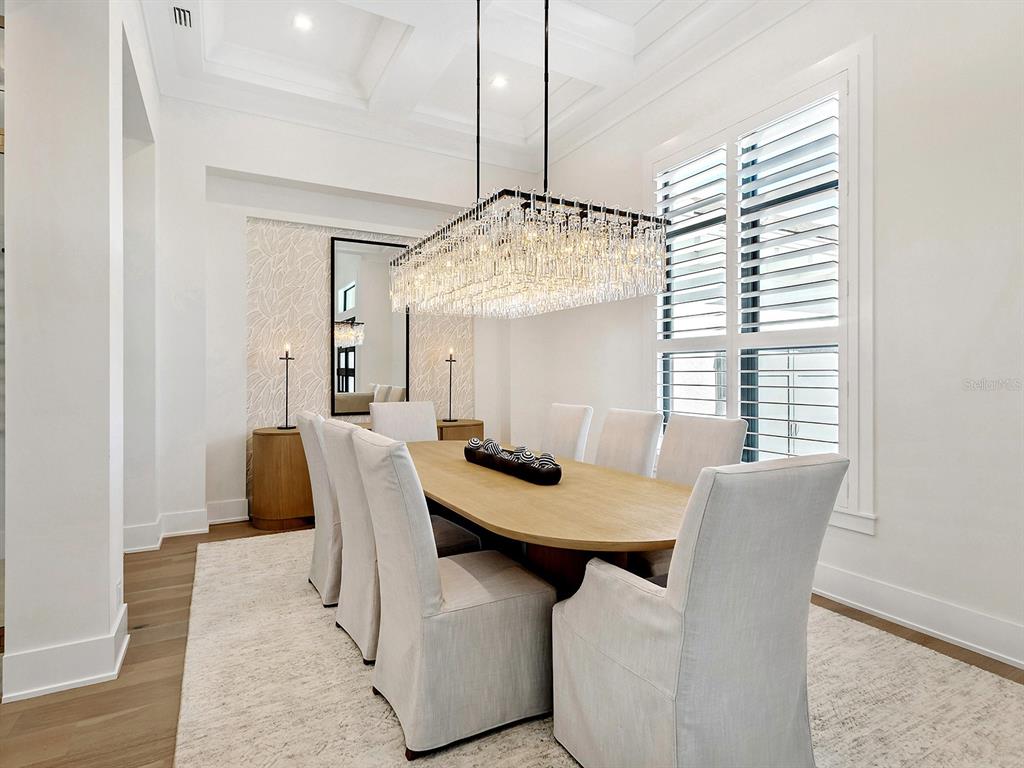 4218 Butte Trail Lakewood Ranch, FL 34211 - Photo 27 of 89 a view of a dining room with furniture and window