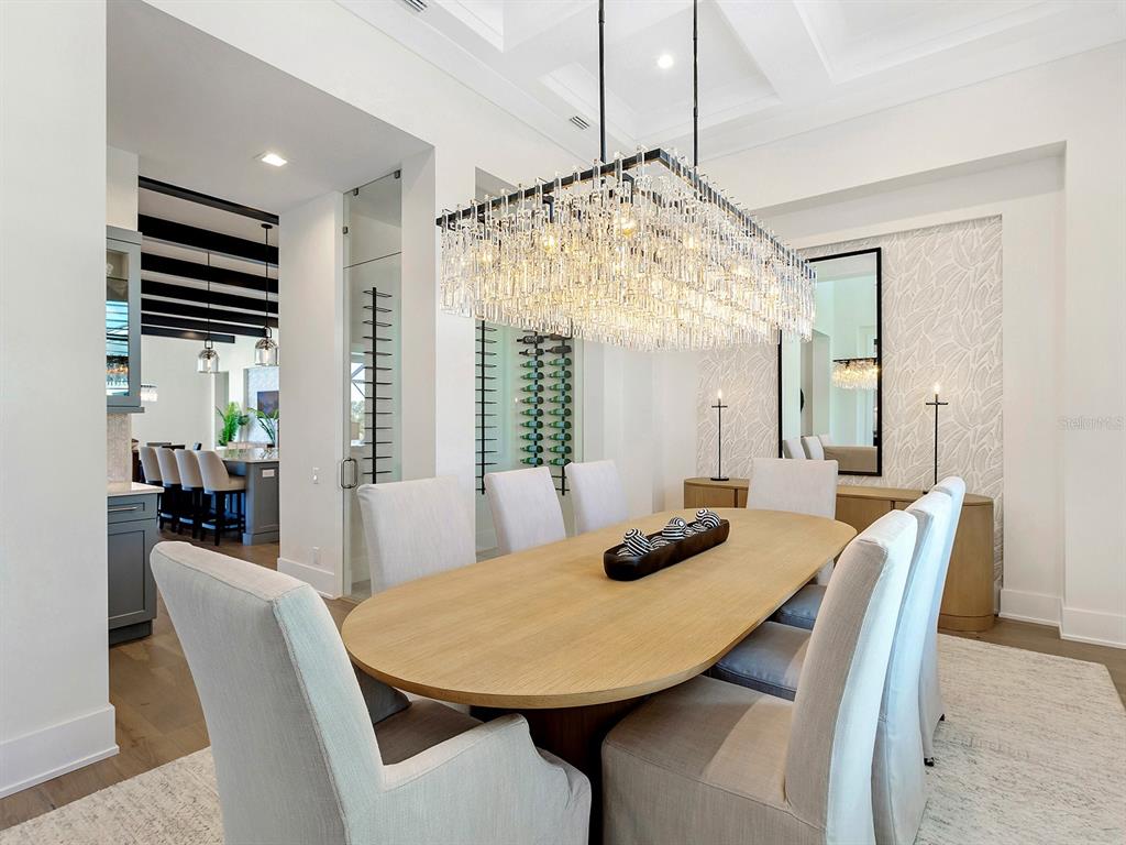 4218 Butte Trail Lakewood Ranch, FL 34211 - Photo 28 of 89 a view of a dining room with furniture window and wooden floor