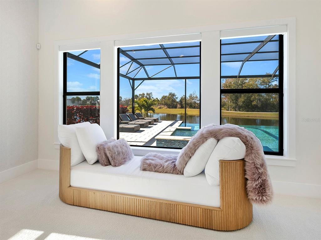 4218 Butte Trail Lakewood Ranch, FL 34211 - Photo 40 of 89 a living room with a large window and a couch