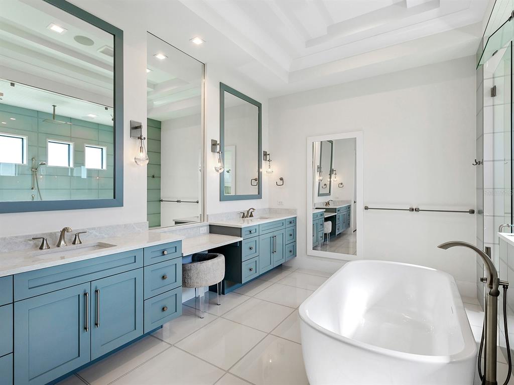 4218 Butte Trail Lakewood Ranch, FL 34211 - Photo 41 of 89 a bathroom with a tub sink and mirror