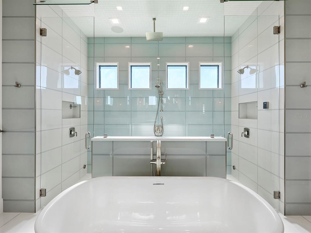 4218 Butte Trail Lakewood Ranch, FL 34211 - Photo 42 of 89 a bathroom with a bathtub and shower