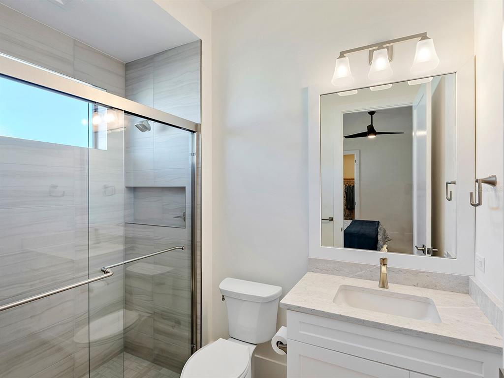 4218 Butte Trail Lakewood Ranch, FL 34211 - Photo 45 of 89 a bathroom with a sink toilet and shower