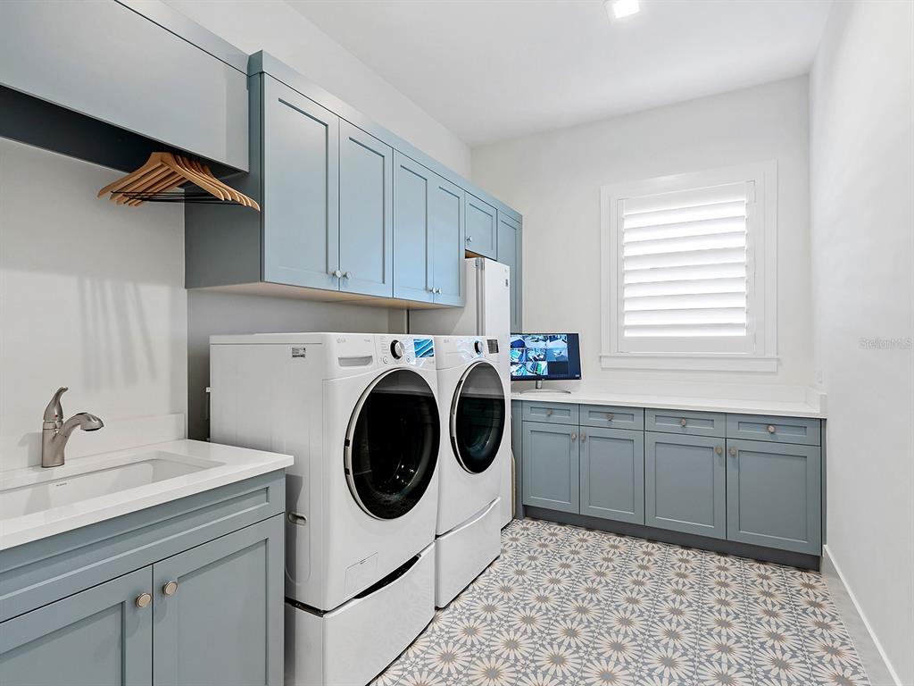 4218 Butte Trail Lakewood Ranch, FL 34211 - Photo 47 of 89 a utility room with sink dryer and washer