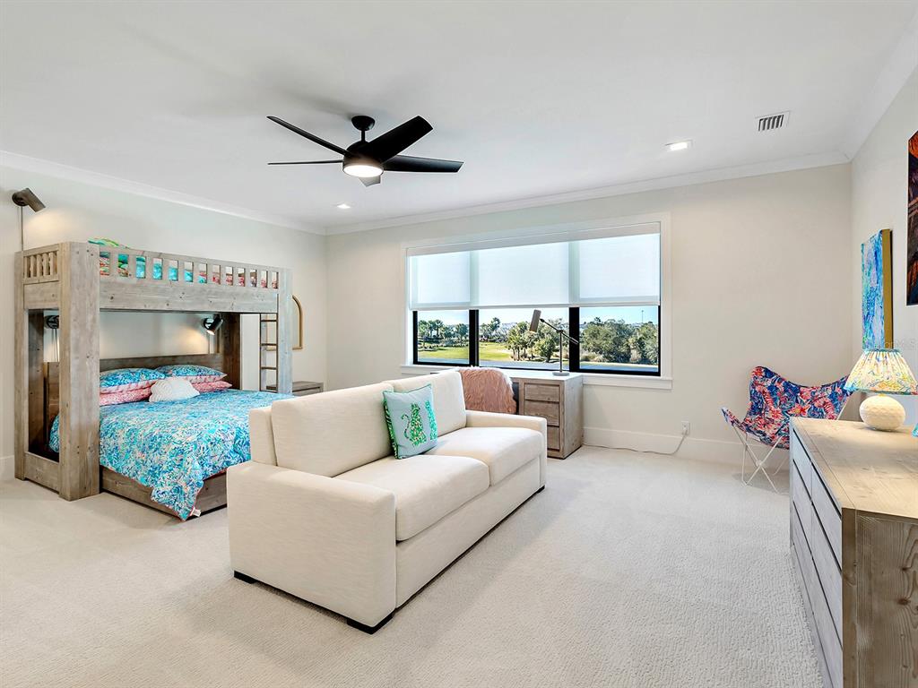 4218 Butte Trail Lakewood Ranch, FL 34211 - Photo 62 of 89 a living room with furniture and a fireplace