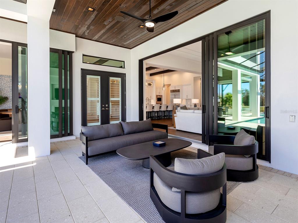 4218 Butte Trail Lakewood Ranch, FL 34211 - Photo 66 of 89 a living room with furniture and a large window