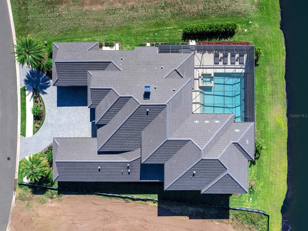 4218 Butte Trail Lakewood Ranch, FL 34211 - Photo 80 of 89 an aerial view of a house with a yard