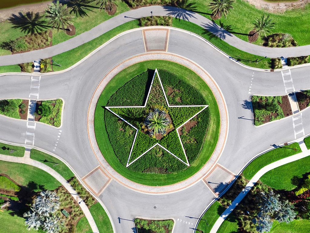4218 Butte Trail Lakewood Ranch, FL 34211 - Photo 89 of 89 an aerial view of a house with outdoor space and trees