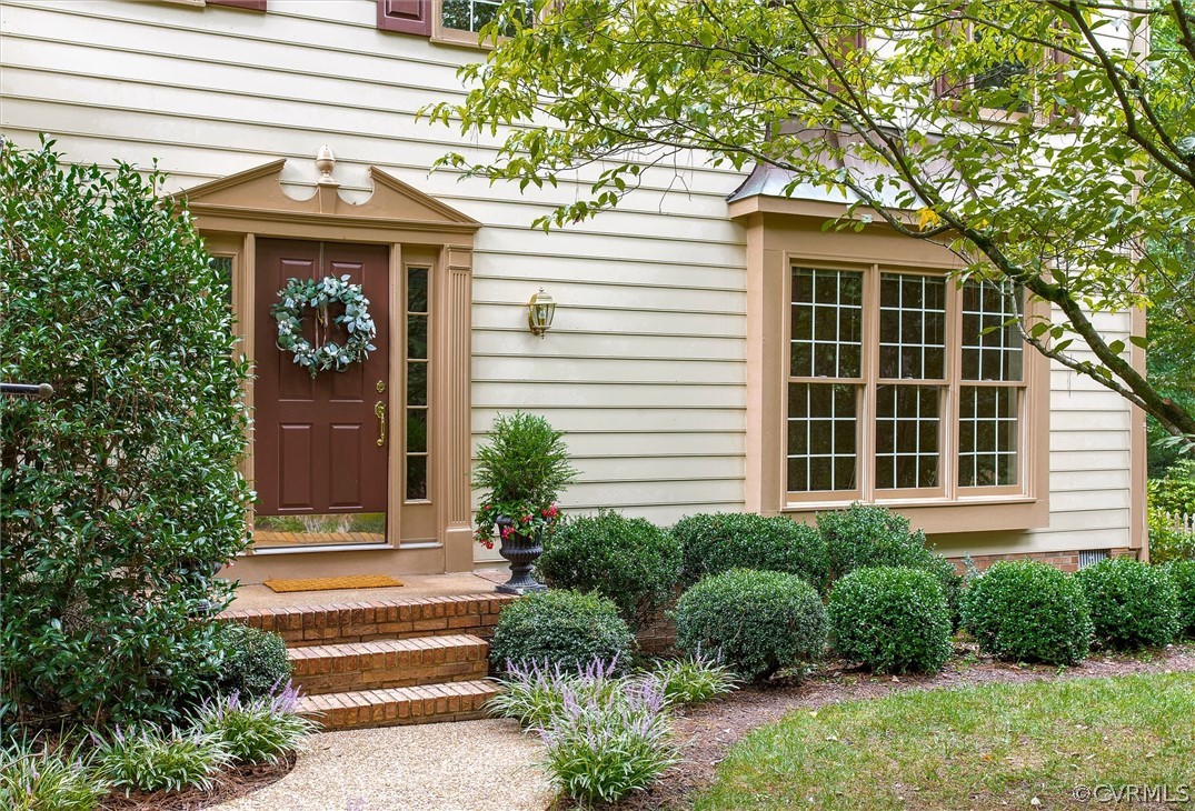 2903 Cove Ridge Road Midlothian, VA 23112 - Photo 3 of 32 a front view of a house with plants and entryway