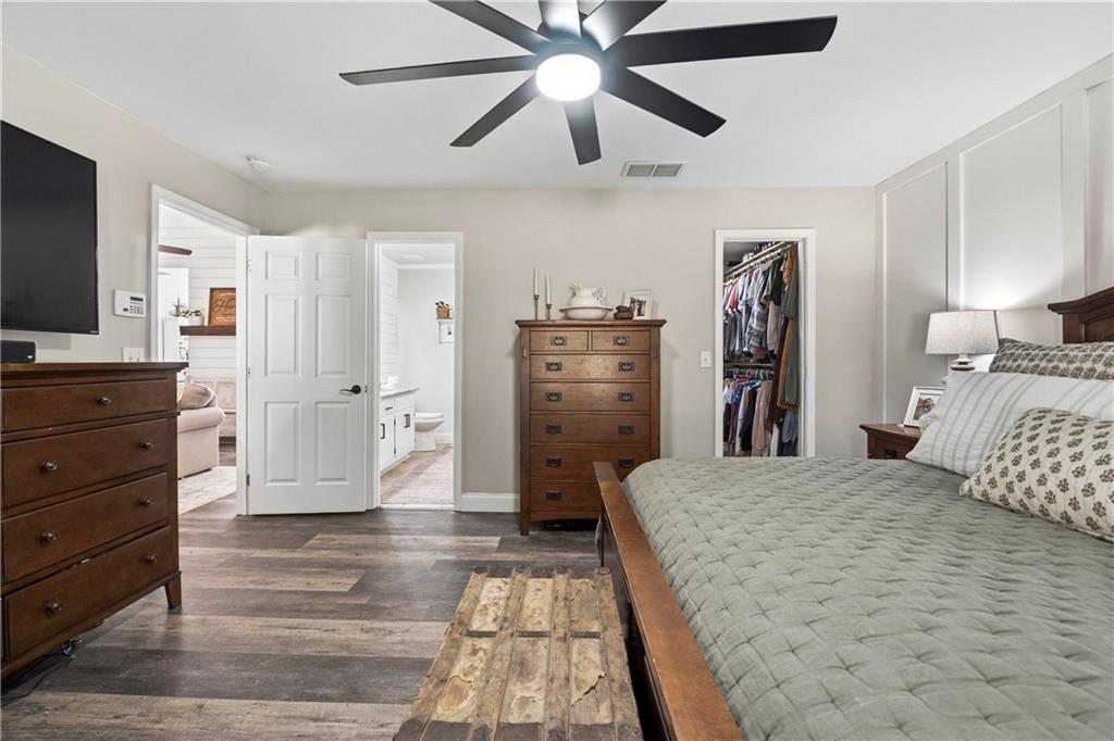 2777 Chickadee Drive Monroe, GA 30655 - Photo 12 of 36 a bedroom with a bed and a flat tv screen on dresser
