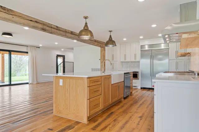 a kitchen with stainless steel appliances a refrigerator and a stove