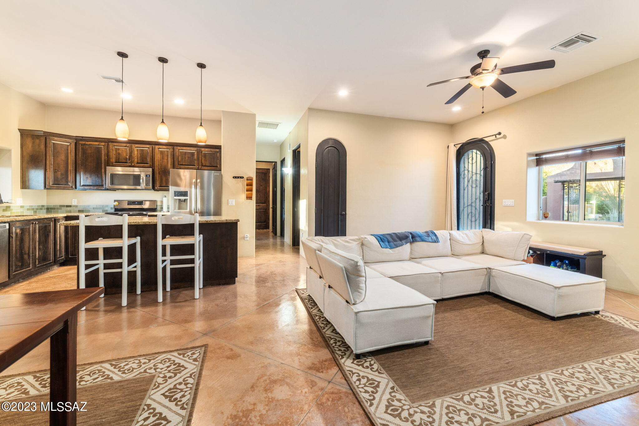 5670 Triangle X Place Tucson, AZ 85713 - Photo 31 of 36 a living room with furniture and a chandelier