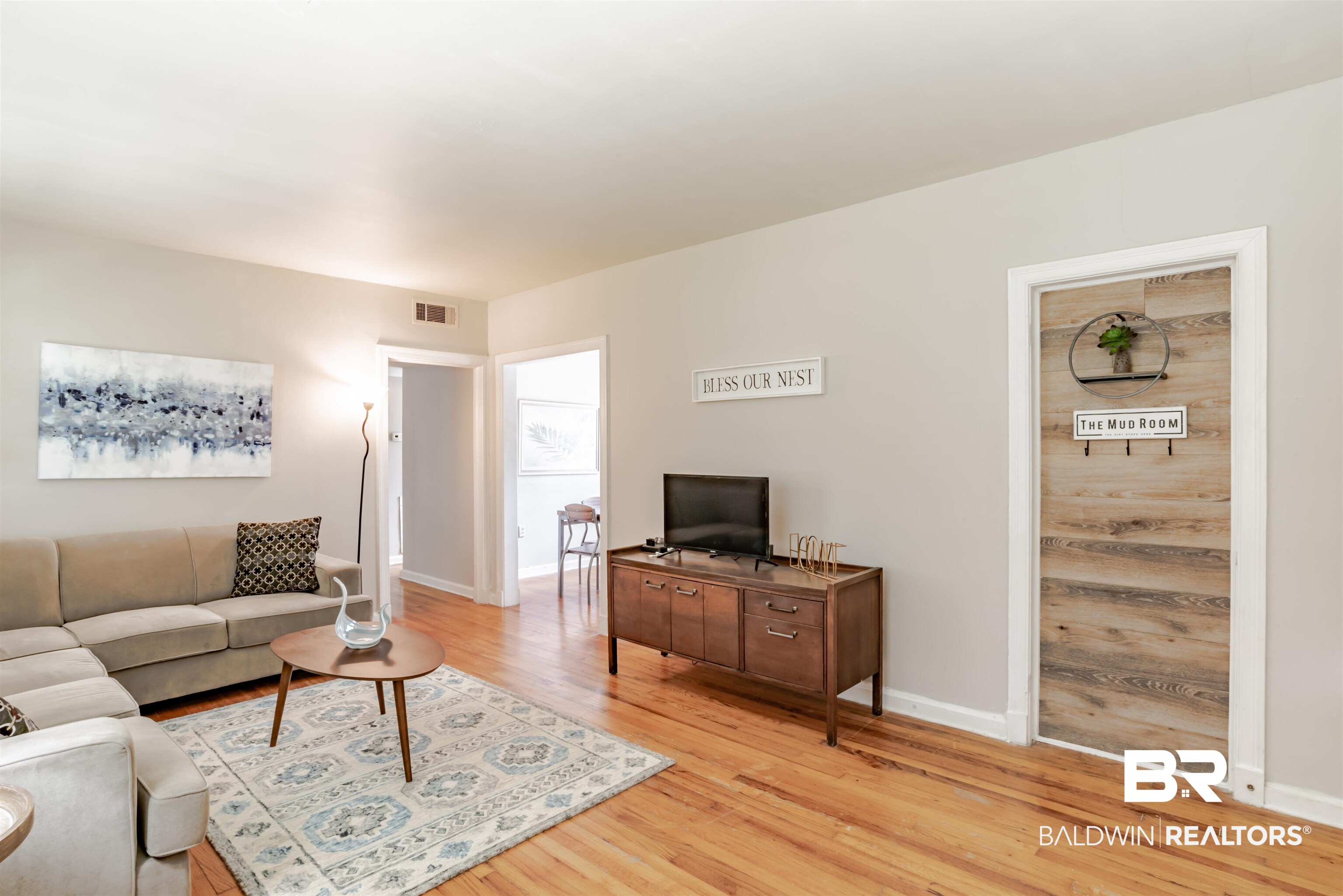 214 Upham Street, Unit 7C Mobile, AL 36607 - Photo 5 of 32 Living room with light wood-type flooring and baseboards