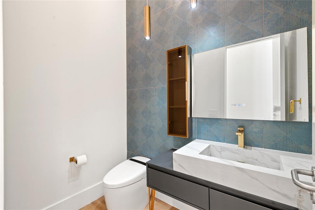 2 Sunset Lane Lauderdale-by-the-Sea, FL 33062 - Photo 14 of 79 a bathroom with a sink and a toilet