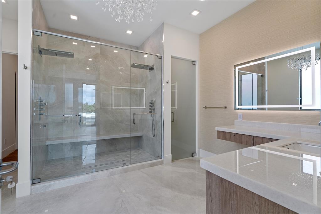 2 Sunset Lane Lauderdale-by-the-Sea, FL 33062 - Photo 23 of 79 a bathroom with a granite countertop sink mirror and shower