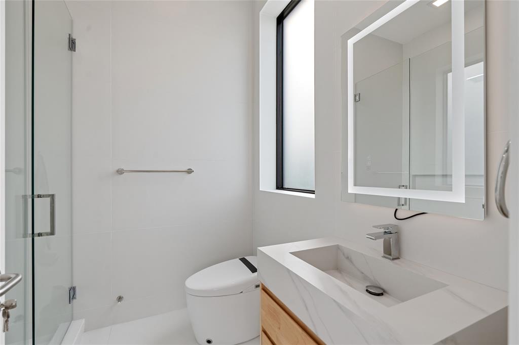 2 Sunset Lane Lauderdale-by-the-Sea, FL 33062 - Photo 29 of 79 a bathroom with a sink a toilet and vanity