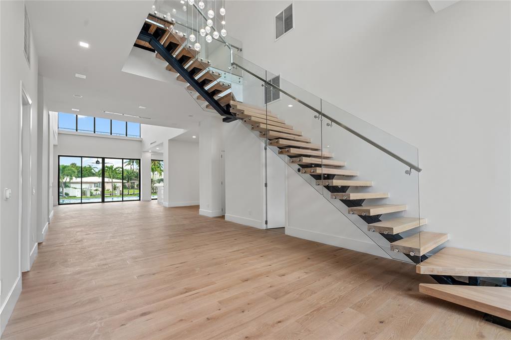 2 Sunset Lane Lauderdale-by-the-Sea, FL 33062 - Photo 3 of 79 a view of entryway and hall with wooden floor