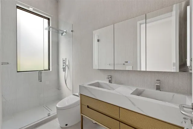 a kitchen with kitchen island a stove a sink and a counter space