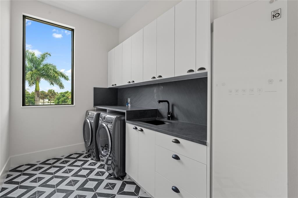 2 Sunset Lane Lauderdale-by-the-Sea, FL 33062 - Photo 34 of 79 a kitchen with stainless steel appliances granite countertop a sink a stove and a refrigerator