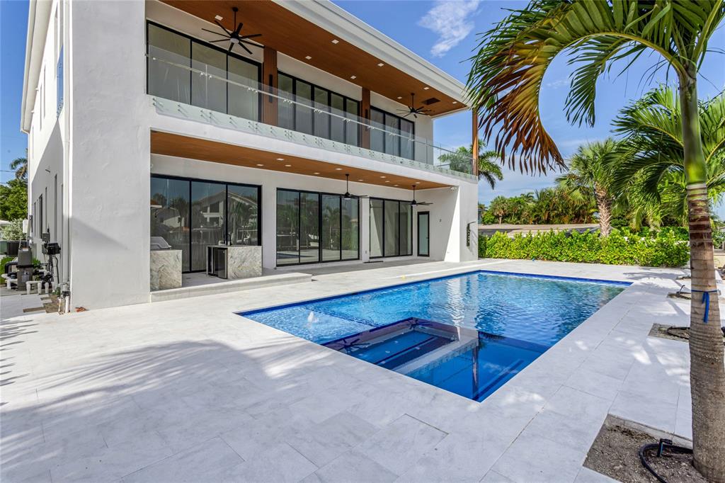 2 Sunset Lane Lauderdale-by-the-Sea, FL 33062 - Photo 36 of 79 front view of a house with a swimming pool