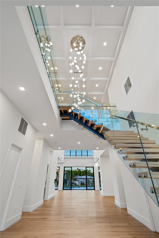 2 Sunset Lane Lauderdale-by-the-Sea, FL 33062 - Photo 56 of 79 a view of a hallway with chandelier
