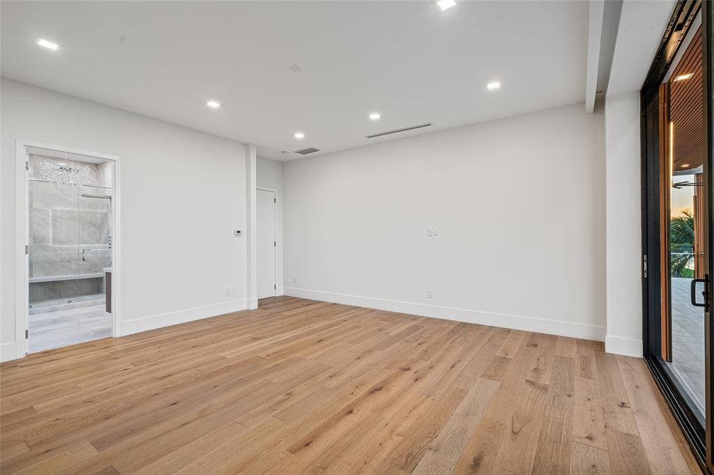 2 Sunset Lane Lauderdale-by-the-Sea, FL 33062 - Photo 61 of 79 an empty room with wooden floor and windows