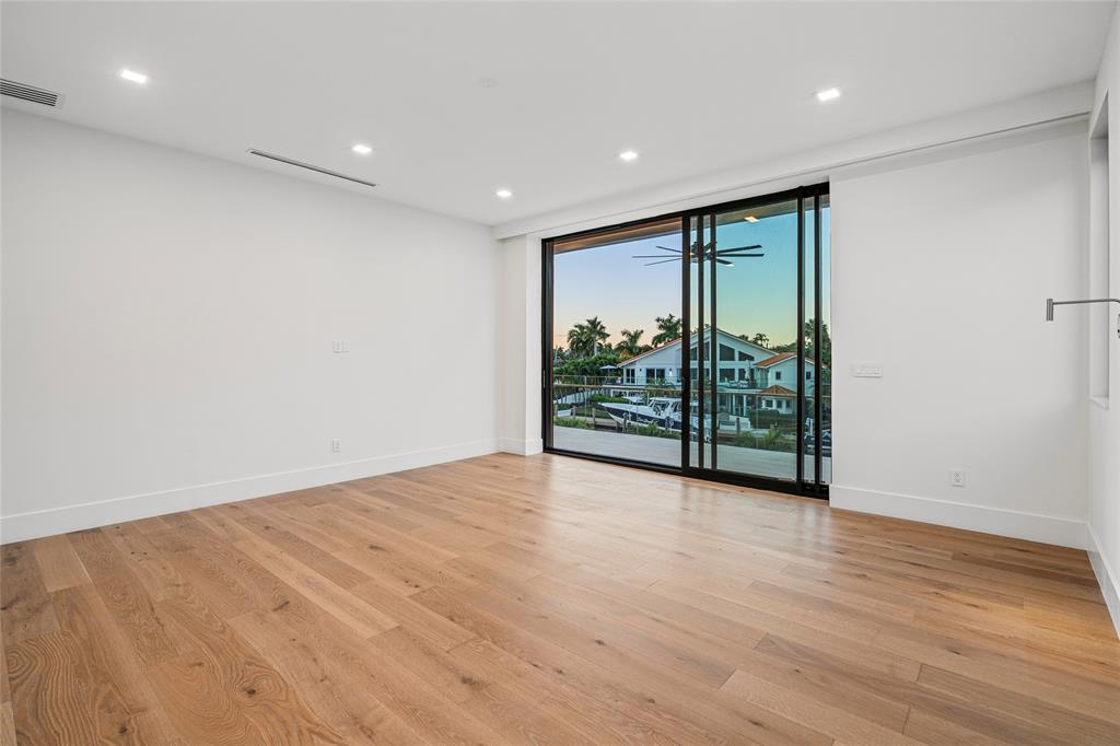 2 Sunset Lane Lauderdale-by-the-Sea, FL 33062 - Photo 63 of 79 a view of an empty room with wooden floor and a window