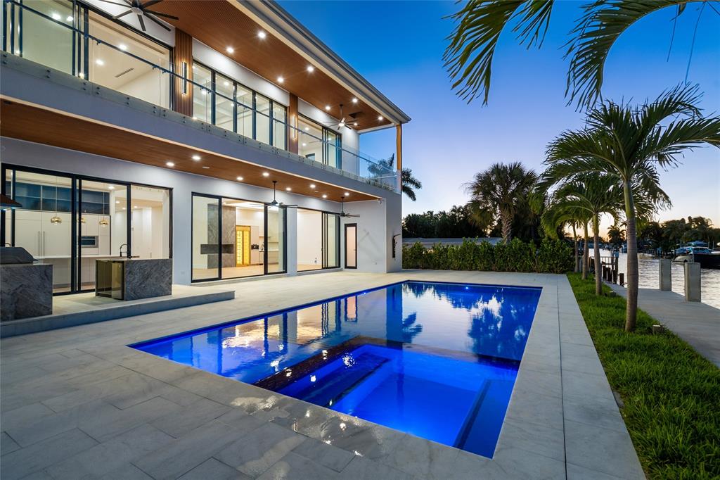 2 Sunset Lane Lauderdale-by-the-Sea, FL 33062 - Photo 71 of 79 a view of a swimming pool with potted plants