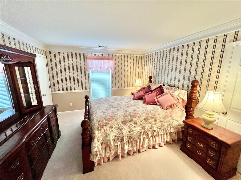 19 Meadow Crest Court Powder Springs, GA 30127 - Photo 14 of 26 a bed room with a bed and a television