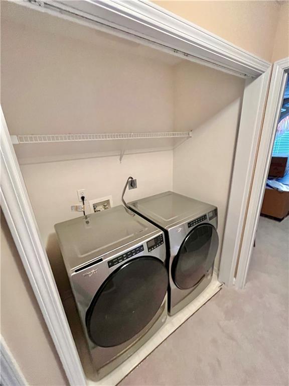 19 Meadow Crest Court Powder Springs, GA 30127 - Photo 15 of 26 a utility room with dryer and washer