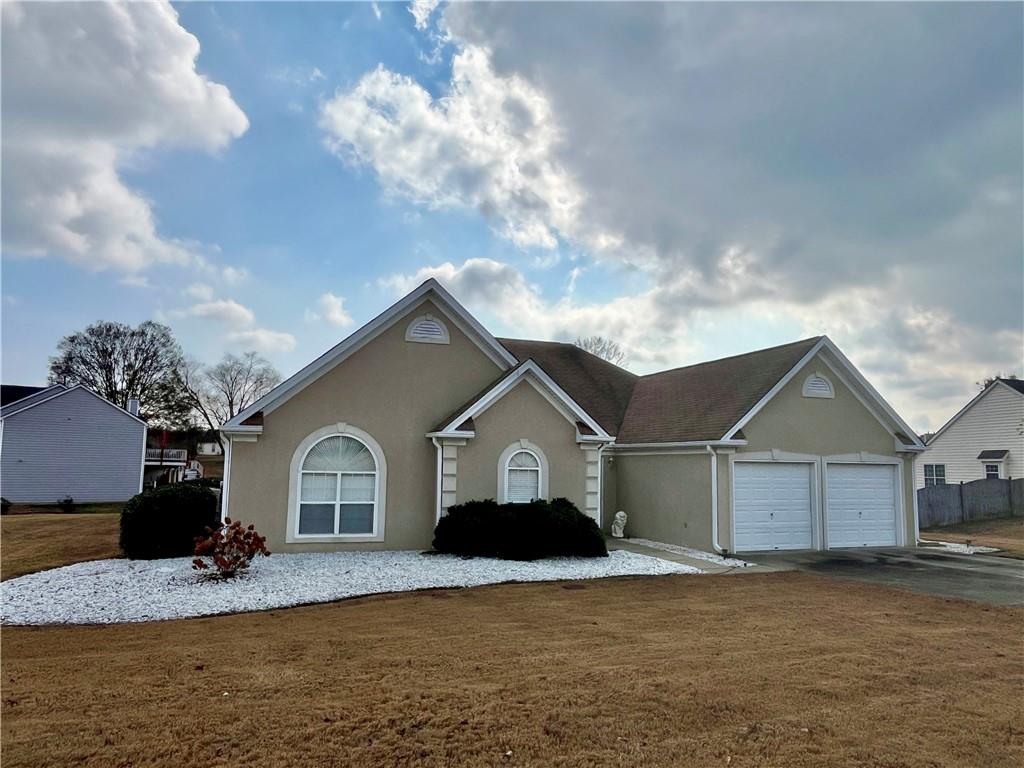 19 Meadow Crest Court Powder Springs, GA 30127 - Photo 2 of 26 a view of a house with a yard