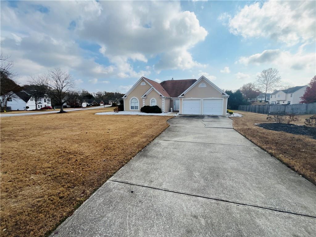 19 Meadow Crest Court Powder Springs, GA 30127 - Photo 21 of 26 a view of an house with backyard and road