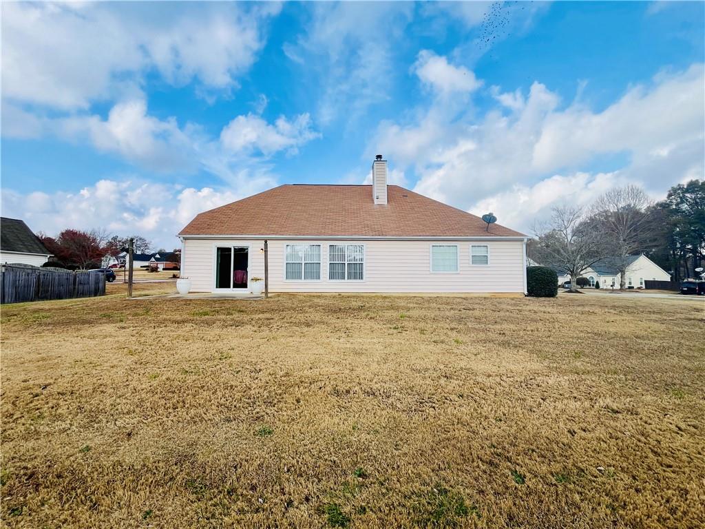 19 Meadow Crest Court Powder Springs, GA 30127 - Photo 24 of 26 a front view of a house with a yard