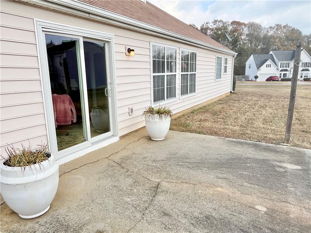 19 Meadow Crest Court Powder Springs, GA 30127 - Photo 25 of 26 a view of a patio with couches and potted plants