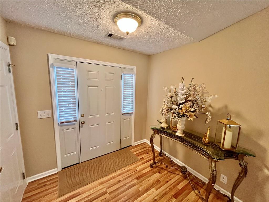 19 Meadow Crest Court Powder Springs, GA 30127 - Photo 3 of 26 a view of a room with wooden floor and closet