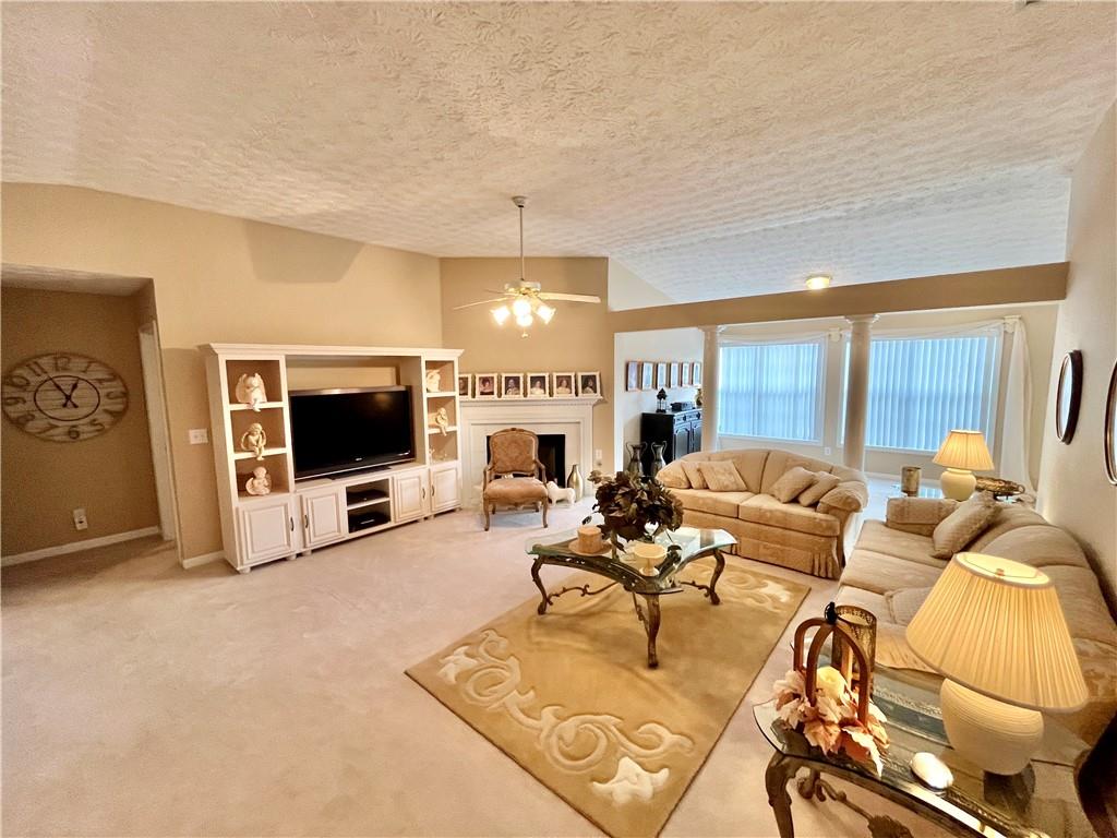 19 Meadow Crest Court Powder Springs, GA 30127 - Photo 4 of 26 a living room with furniture and a flat screen tv
